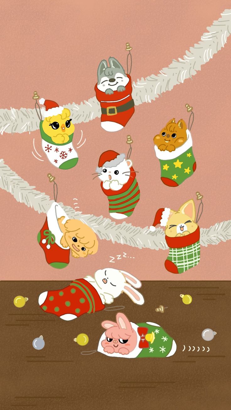 a bunch of cats hanging from a christmas tree with stockings on it's feet