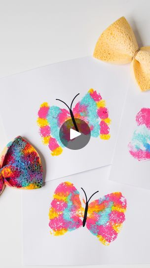 three butterfly crafts with different colors and shapes on paper next to each other, one has a bow tie