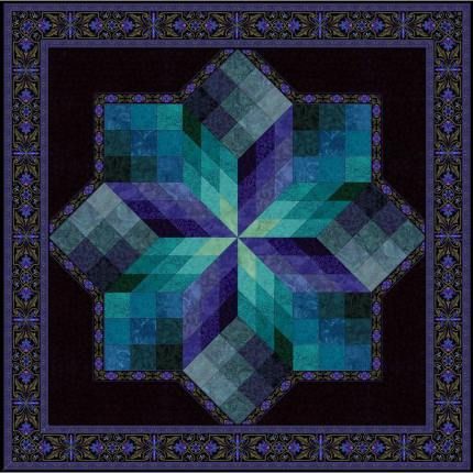 a blue and black quilt with an intricate design on the center, surrounded by smaller squares