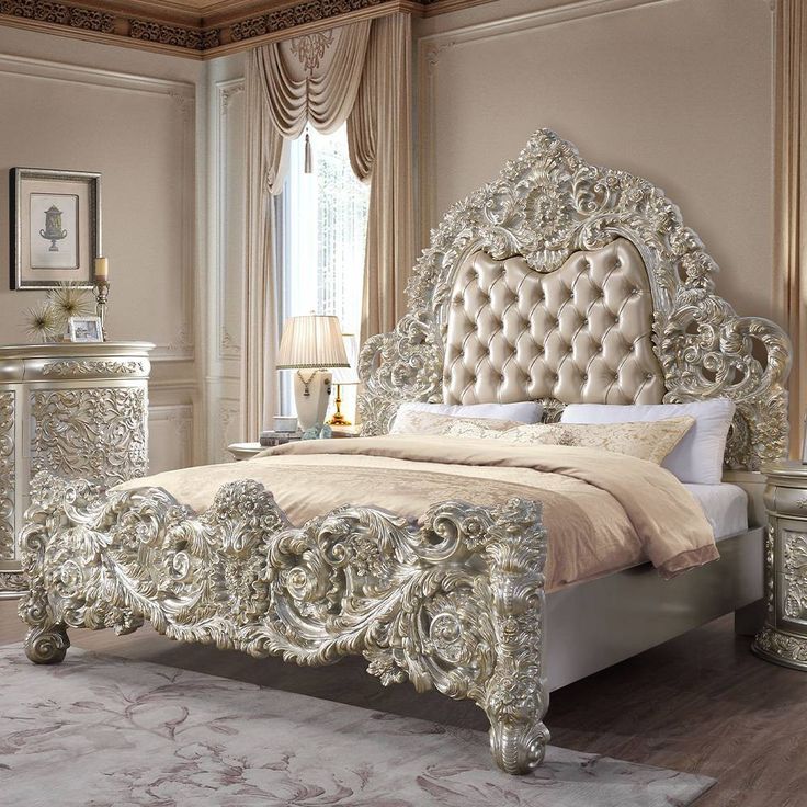 a bedroom with a bed, nightstands and pictures on the wall above it is decorated in gold and silver