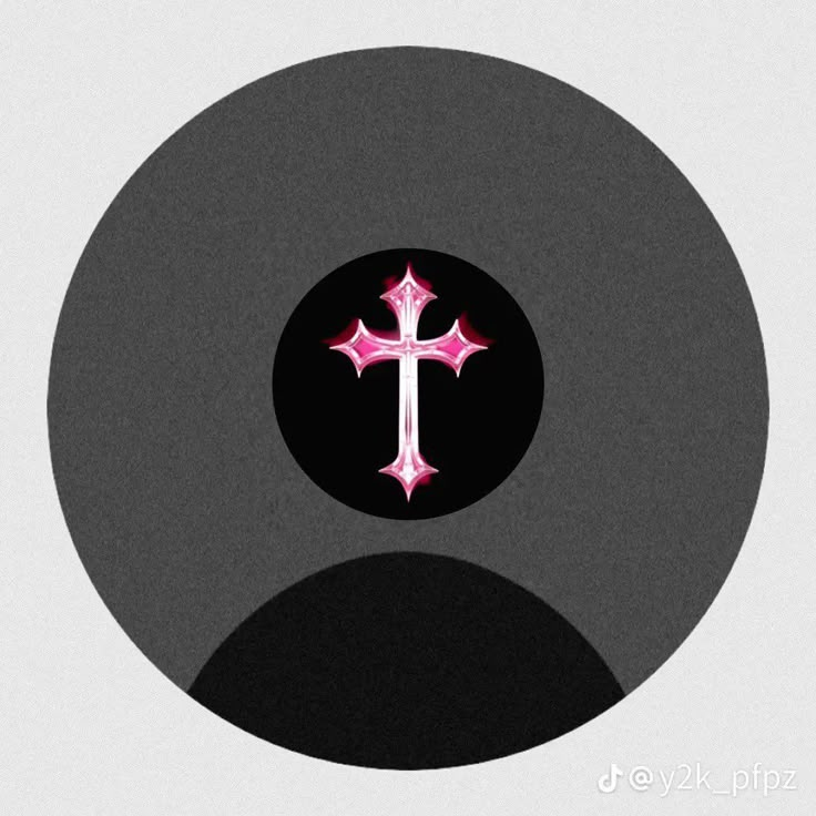 a cross with pink lights on it in a black circle