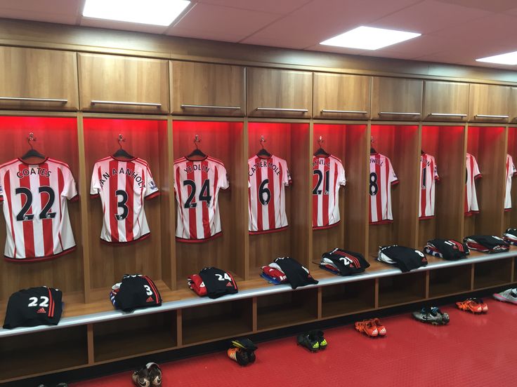 the men's soccer team uniforms are on display in the locker room at the stadium