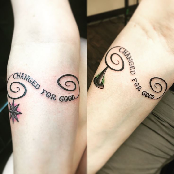 two people with tattoos on their legs and the words changed for good written in cursive writing