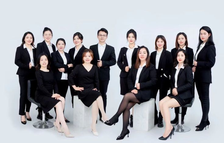 a group of business people posing for a photo