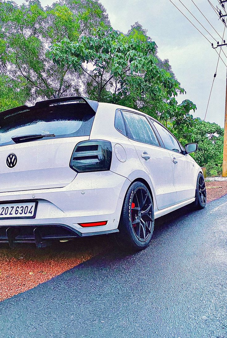 a white car parked on the side of the road