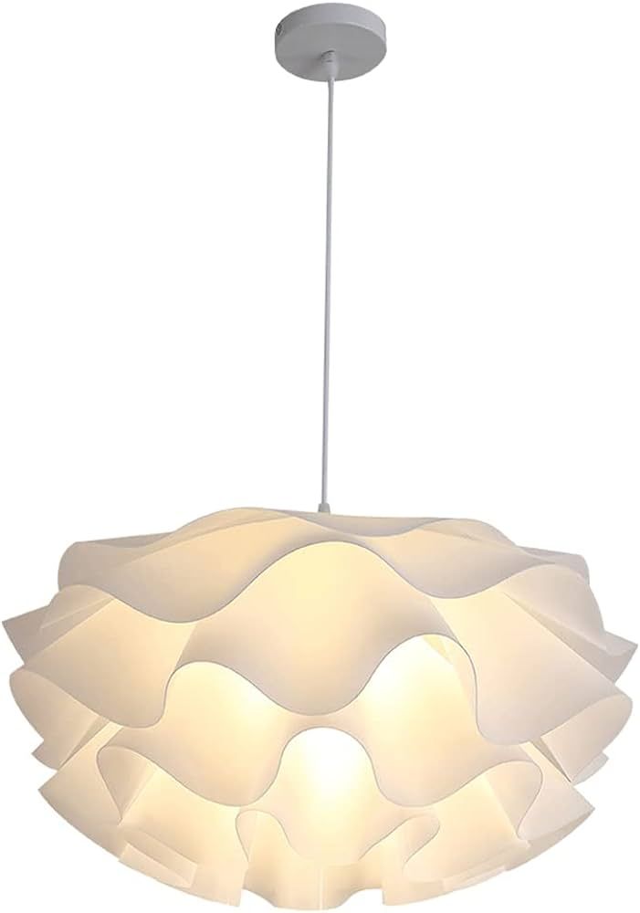 a white light hanging from the ceiling with a circular shade on it's side