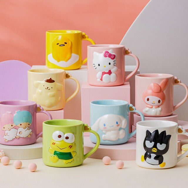 many different colored coffee mugs with cartoon characters on them and one in the middle