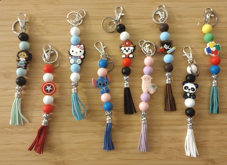 several different key chains with charms attached to them