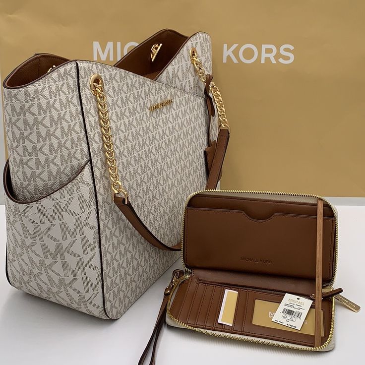 Michael Kors Large X Chain Shoulder Tote & Lg Flat Multifunctional Phone Case-Wristlet-Wallet Jet Set Large Logo Shoulder Bag Shoulder Bag Vanilla Signature Logo-Print Canvas 89.4% Coated Canvas/9.6% Polyester/1% Polyurethane Gold-Tone Hardware 15.6”W X 11”H X 5.5”D Handle Drop: 10" Exterior Details: Front Slip Pocket Interior Details: Back Zip Pocket, 2 Back Slip Pockets Lining: 100% Polyester Zip Fastening Imported & Lg Flat Multifunctional Phone Case Material: Leather/Pvc Removable Leather Wrist Strap Zip Around Closure Gold Tone Hardware Vanilla Signature Color Interior Cell Phone Pocket, Id Window, 6 Card Sl Michael Kors Tote Bag, Michael Kors Tote Bags, Exterior Details, Michael Kors Shoulder Bag, Travel Tote Bag, Michael Kors Purse, Fancy Bags, Monogram Bag, Black Leather Handbags