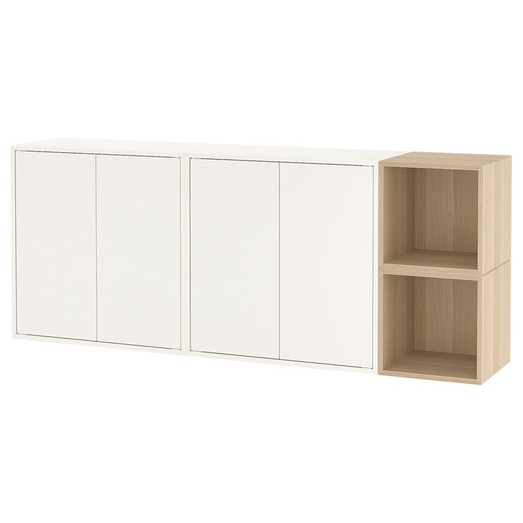 a white cabinet with two doors and shelves