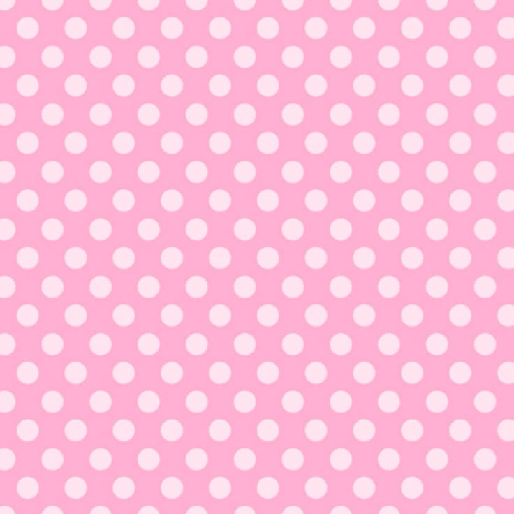 a pink background with white polka dots