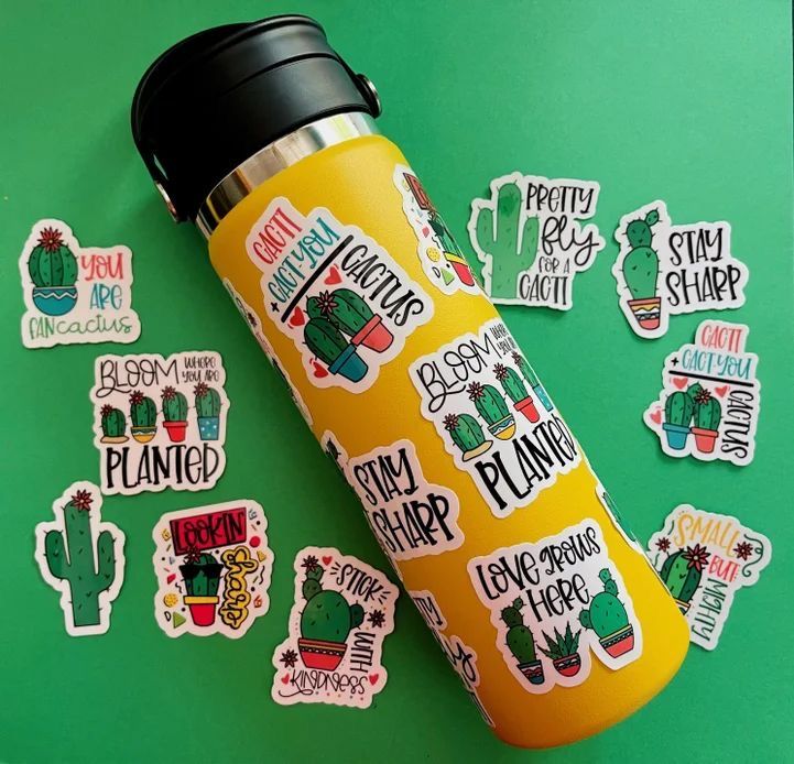 stickers and decals on a green surface including cactus, cacti, and succulents