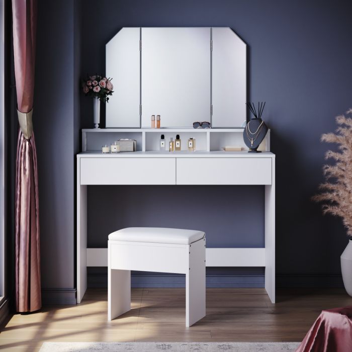 a white dressing table with mirror and stool