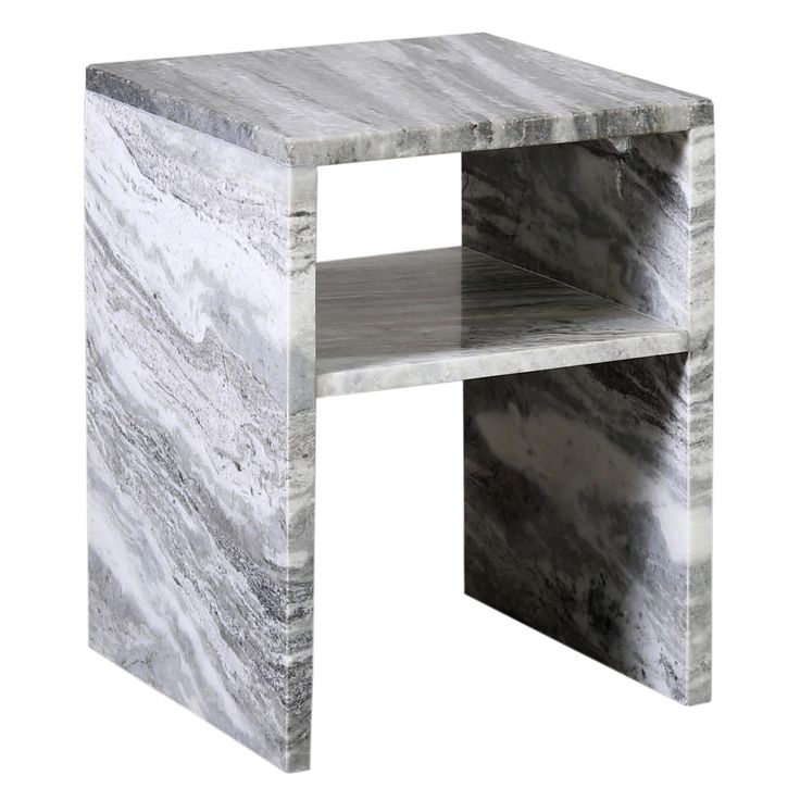 a white marble side table with one shelf on the top and two shelves below it