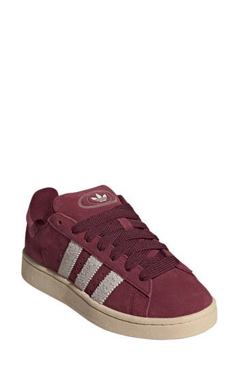 Serrated 3-Stripes and matching Trefoils stand out on this suede sneaker featuring extrasoft cushioning on the tongue and cuff for a skate-inspired twist. Lace-up style Leather or leather and textile upper/textile lining/rubber sole Imported Red Adidas Campus, Dark Red Shoes, Maroon Shoes, Adidas Campus 00s, Burgundy Shoes, The Tongue, Adidas Campus, Red Sneakers, Red Stripe