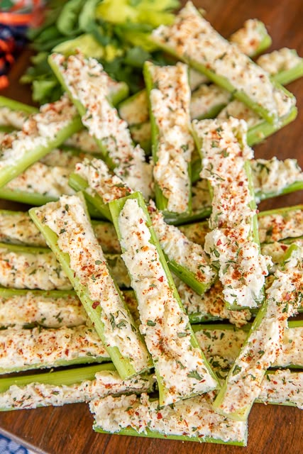 there are many pieces of cucumber with seasoning on them sitting on a plate