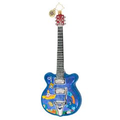 a blue guitar ornament hanging on a wall