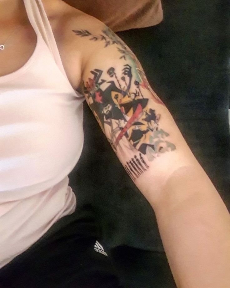 a woman with a tattoo on her arm