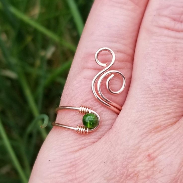 This beautiful, handcrafted spiral ring displays the free spirited outlook of the gypsy and is made out of high quality non-tarnish coated copper wire and a beautiful green Chrome Diopside stone. Delicate and free spirited, this boho statement ring is sure to get many admiring glances!Name: Whale SpoutSIZING: You can choose from sizes 3 to 14!STONE: Diopside is a creative stone and stimulating to the intellect. It is a great assistant to learning, especially if it is something new. A wonderful h