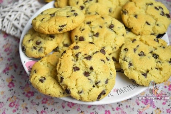 a plate full of chocolate chip cookies on a table