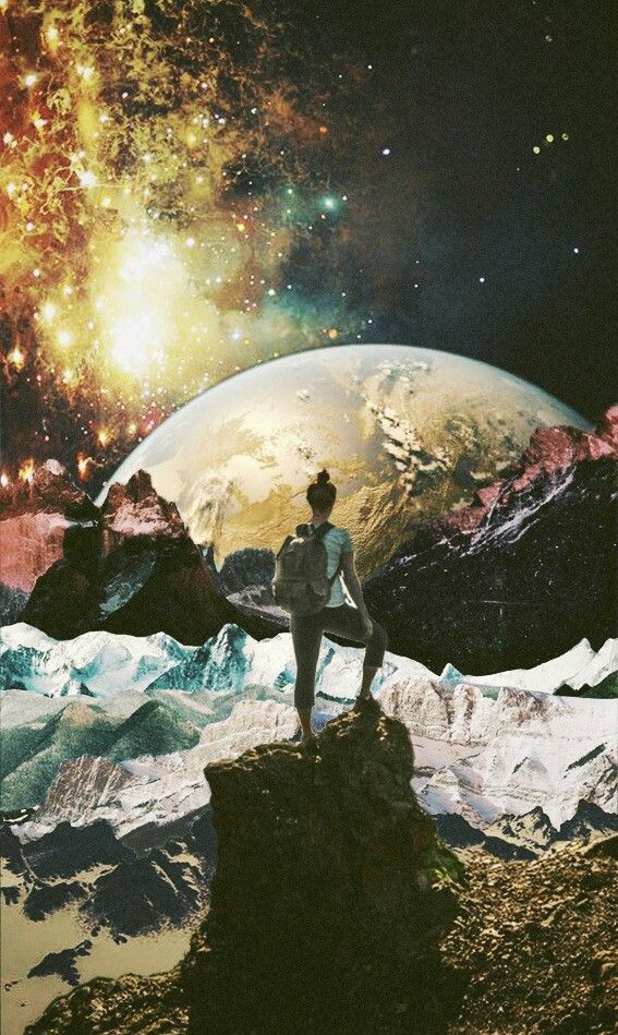 a man standing on top of a mountain under a sky filled with stars and planets