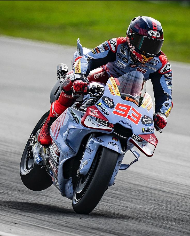 a person riding a motorcycle on a race track