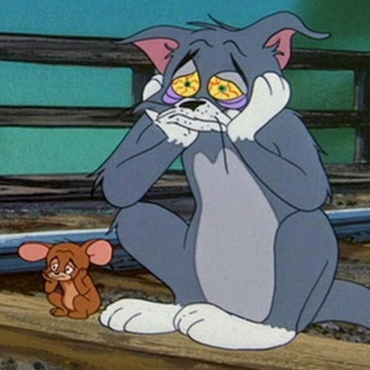 a cartoon cat sitting on top of a wooden bench next to a small brown teddy bear