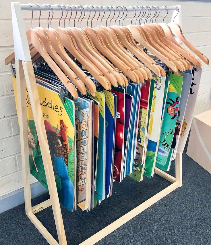 a rack filled with books on top of a carpeted floor