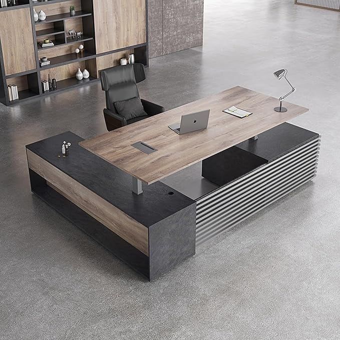 an office desk with a laptop on it