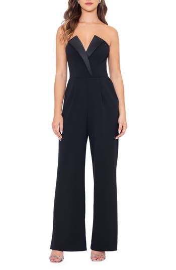 A tuxedo-inspired strapless bodice brings black-tie glamour to this jumpsuit crafted in a wide-leg silhouette and furnished with a pair of handy pockets. Hidden back-zip closure Deep V-neck Strapless Front slant pockets Lined 94% polyester, 6% spandex Spot clean Made in the USA Glamorous Formal Pantsuit, Elegant Wide Leg Pantsuit, Elegant Tailored Pantsuit For Party, Elegant Tuxedo For Gala, Elegant Black Tuxedo For Night Out, Tailored Chic Tuxedo For Evening, Chic Tailored Tuxedo For Evening, Formal Strapless Fitted Jumpsuits And Rompers, Fitted Strapless Jumpsuits And Rompers For Formal Occasions