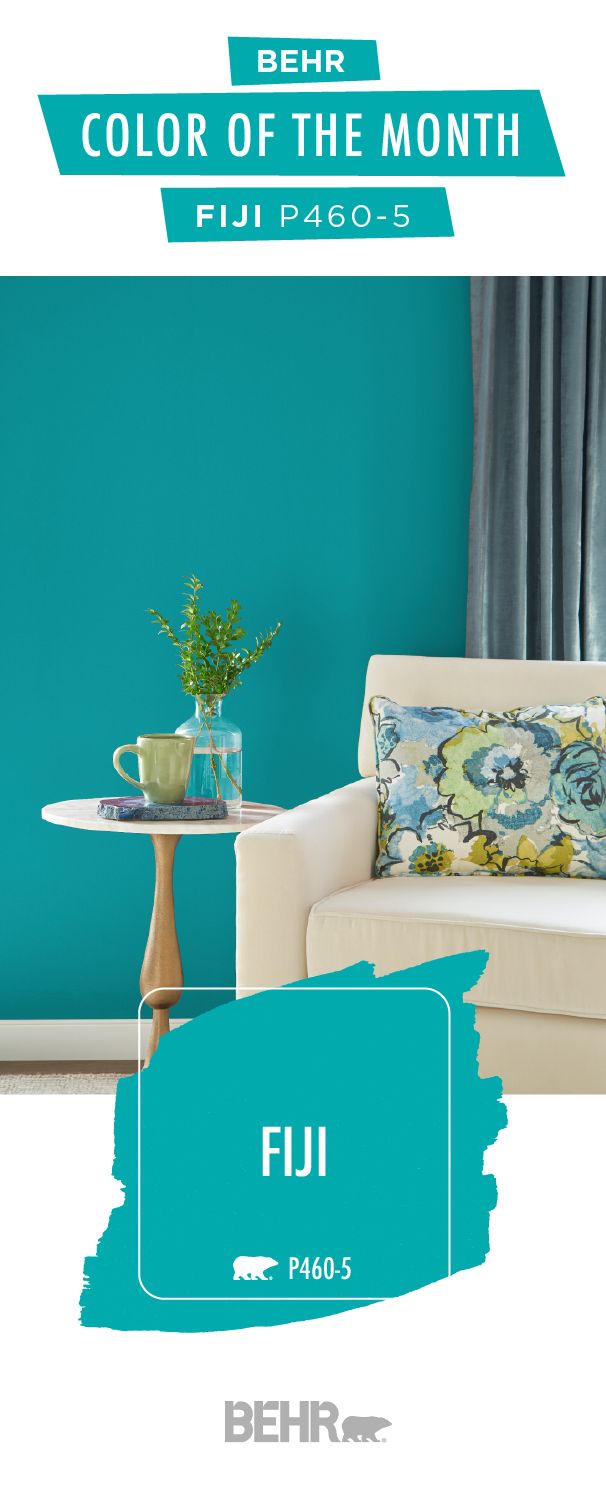 a living room with blue walls and furniture in the color of the month flui