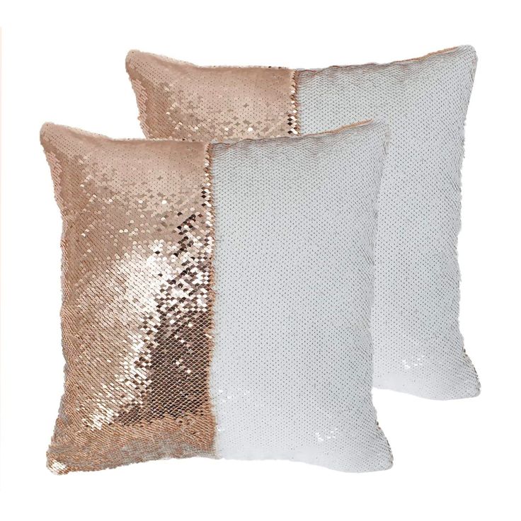 two white and gold pillows with sequins on the sides, one is pink