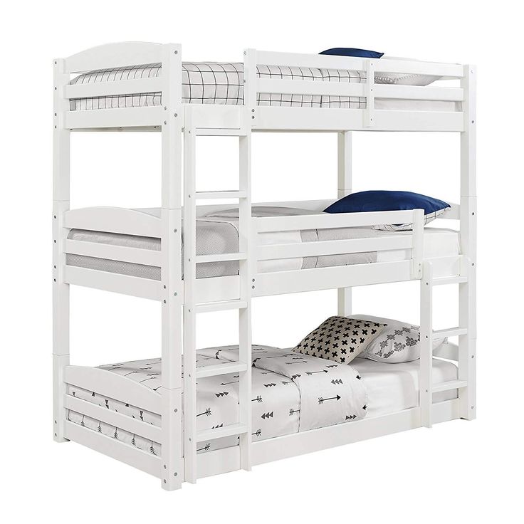 a white bunk bed with two sets of mattresses on the bottom and one side