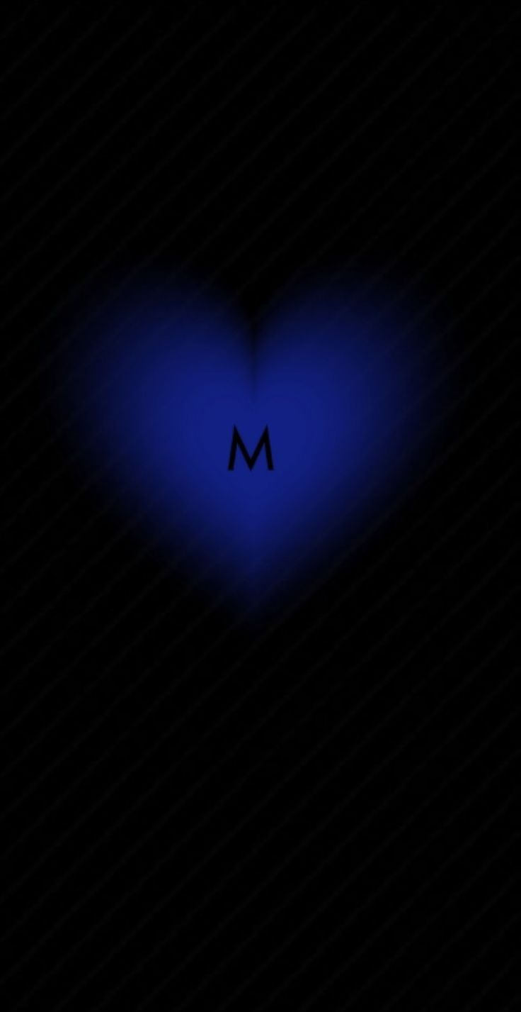 a blue heart with the letter m in it's center on a black background