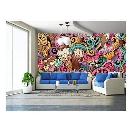 a living room filled with blue couches next to a wall covered in colorful art