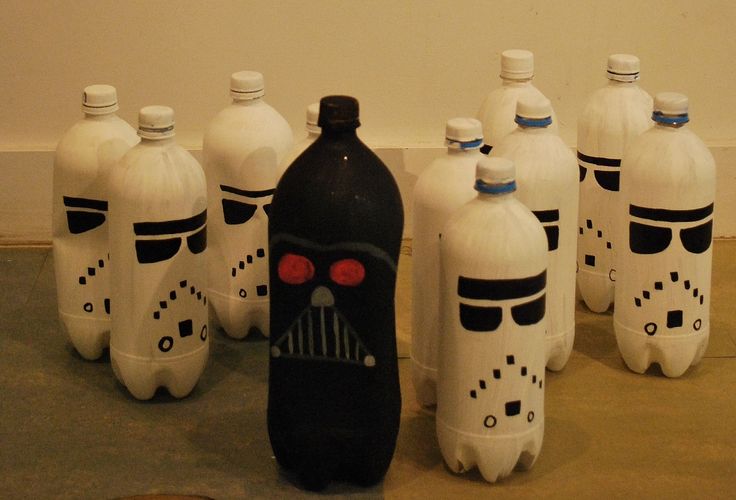 a group of plastic bottles with faces painted on them