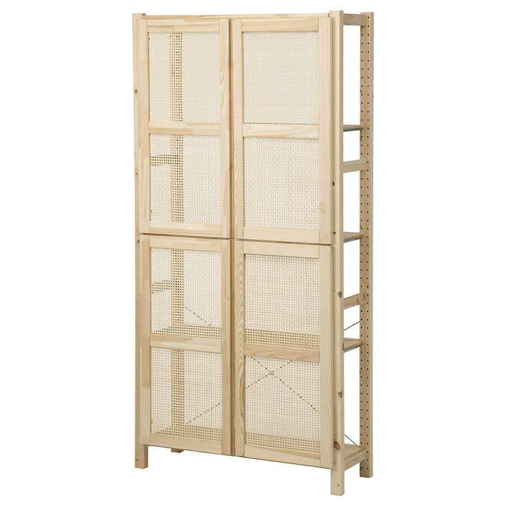 a tall wooden cabinet with three doors and shelves on each side, in front of a white background