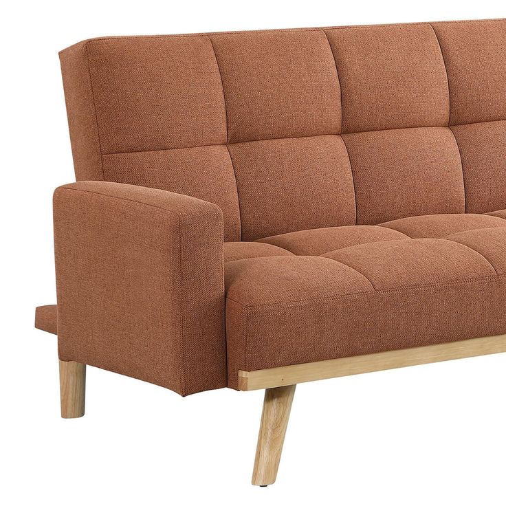 a brown couch sitting on top of a wooden frame