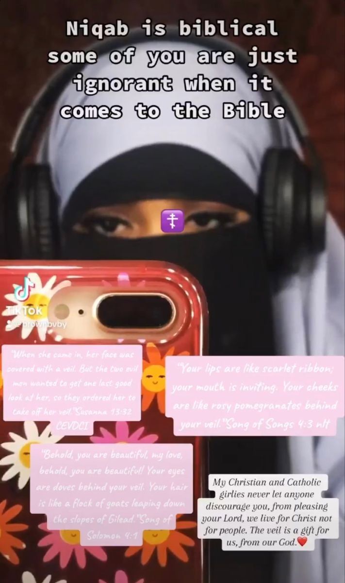 a woman in hijab holding an iphone case with notes attached to the back