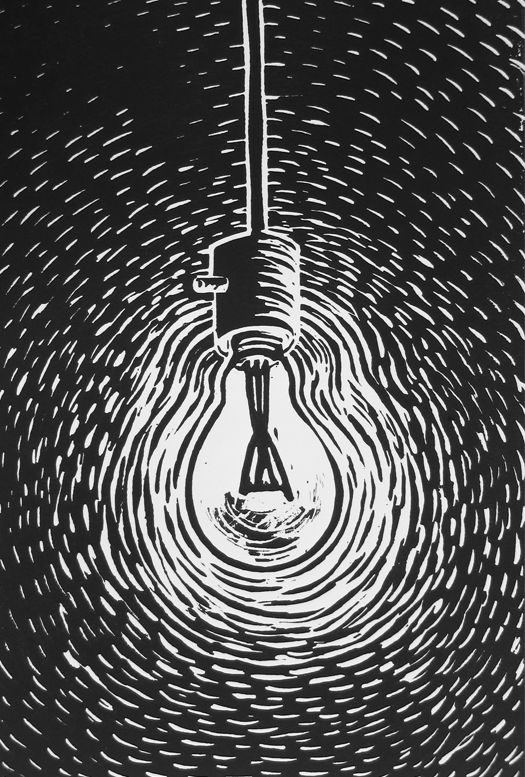 a black and white image of a light bulb in the middle of a circular pattern