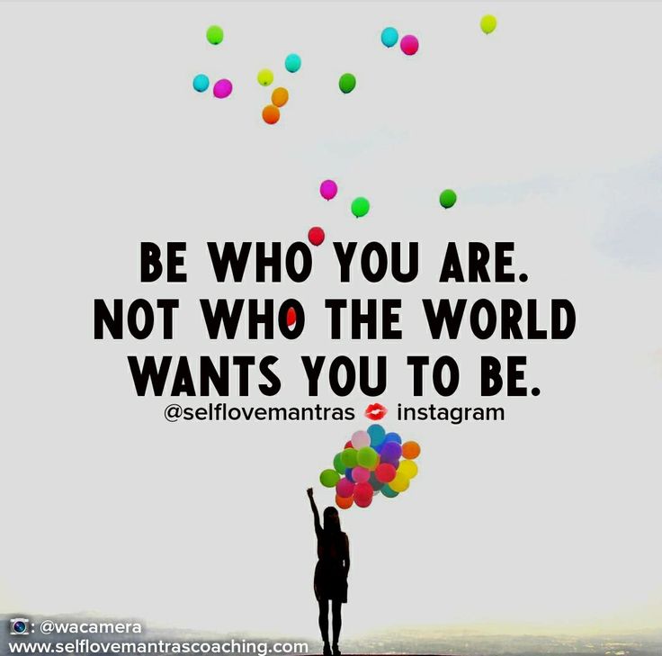 a person holding balloons with the words be who you are not who the world wants you to be