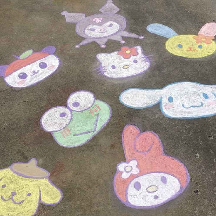 the sidewalk has been decorated with chalk and crayons to look like cartoon characters