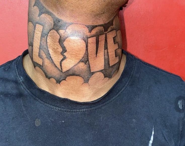 a man with a tattoo on his neck and the word love is written in large letters