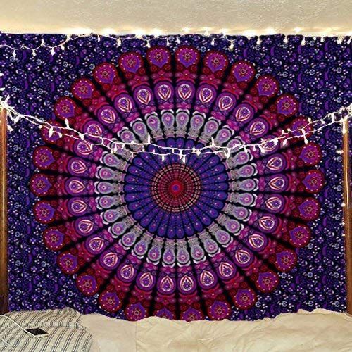 a purple and blue tapestry hanging on a wall