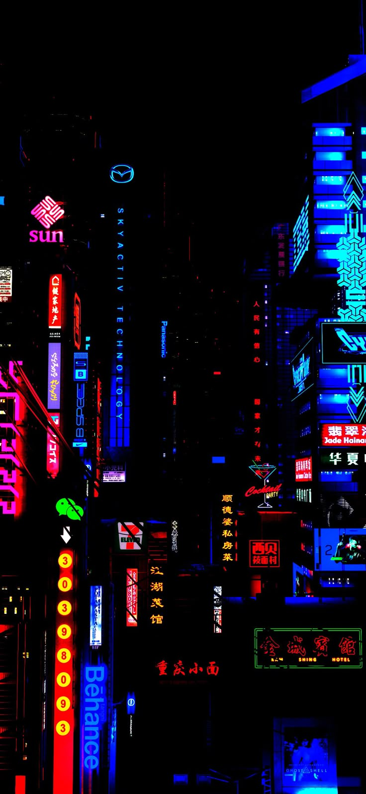 the city is lit up at night with neon signs and buildings in the dark sky