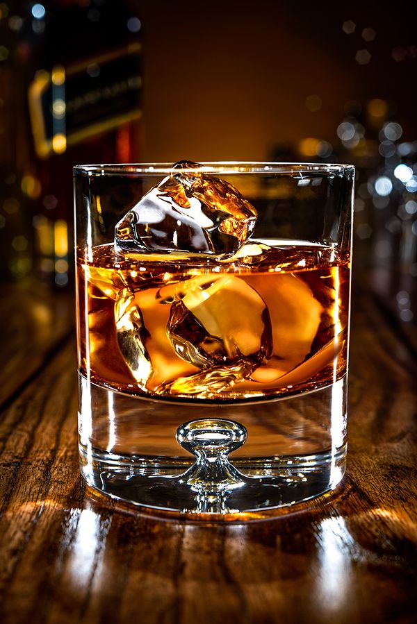 an old fashioned whiskey glass with ice cubes