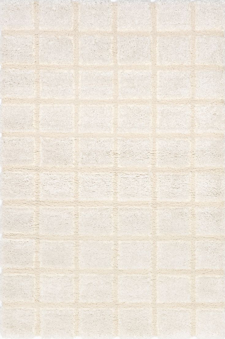 a white rug with squares on it