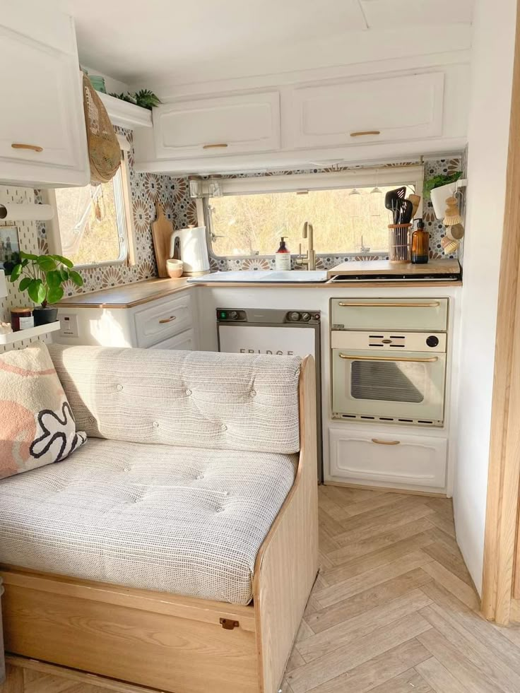 a small kitchen and living area in a tiny home