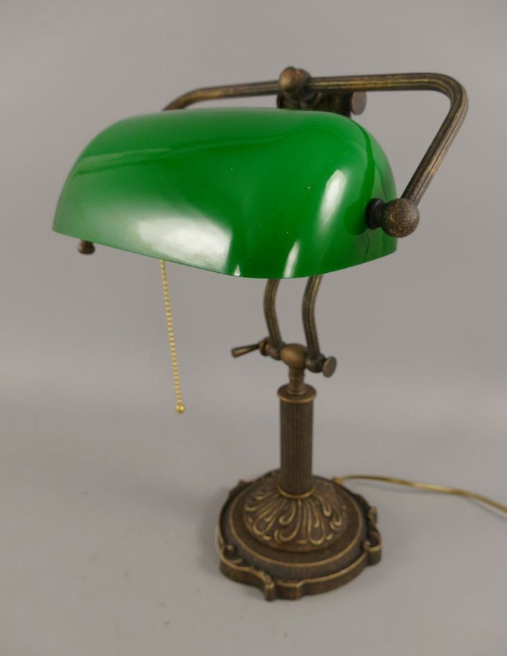 Introducing the Antique Brass Banker's Desk Lamp with Green Glass Shade, a timeless piece that exudes elegance and sophistication. This exquisite desk lamp showcases a beautiful brass finish, giving it a touch of vintage charm and character. Crafted with attention to detail, it features a stunning green glass shade that provides a soft and subtle glow, perfect for creating a warm and inviting ambiance in any space. Measuring at a convenient size, this lamp is 27 cm in length, 16 cm in width, and Weird Lamps, Bankers Desk Lamp, Apt Decor, Brass Desk Lamp, Baroque Decor, Diy Miniatures, Bankers Lamp, Brass Desk, Glass Office