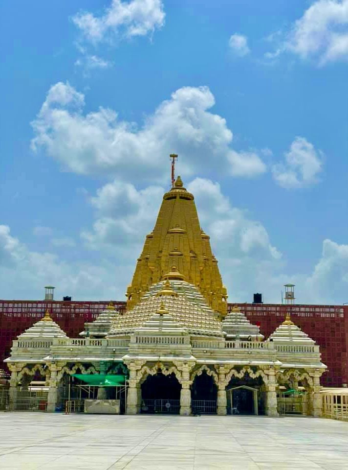 a large white building with a cross on top